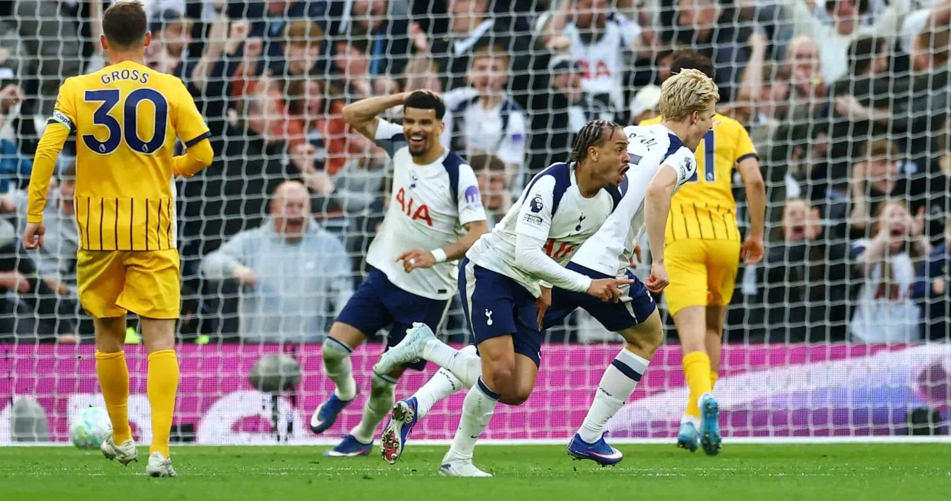 Tottenham players celebrating a goal against Brighton
