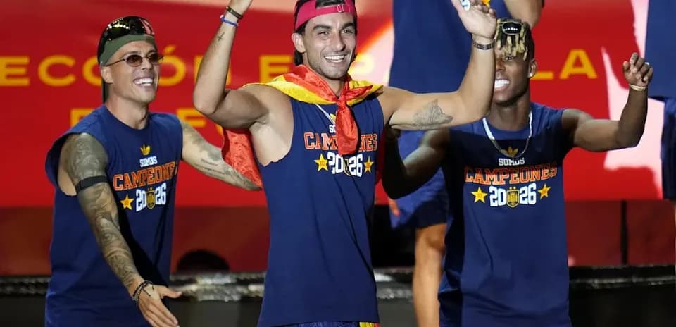 Players celebrating on stage with championship shirts