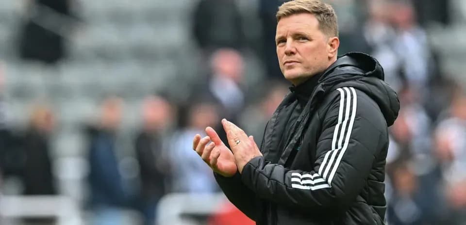 Manager clapping during match at stadium