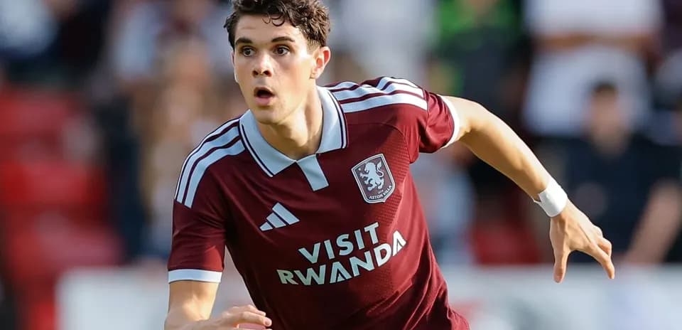 Player in maroon kit running during match