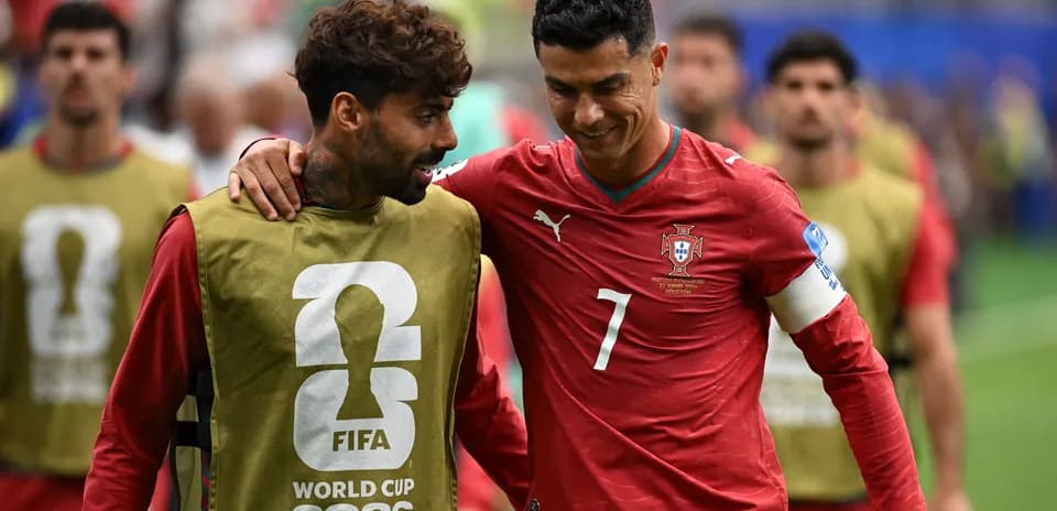 Two Portuguese players interacting on the field