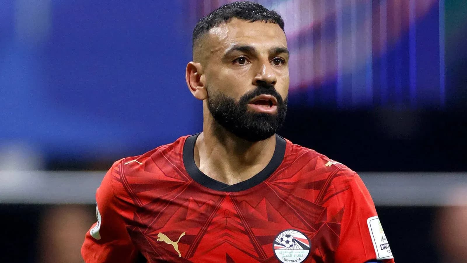 Player in red jersey during match action