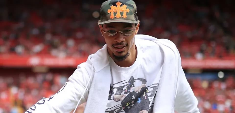 Player greeting fans at the stadium entrance