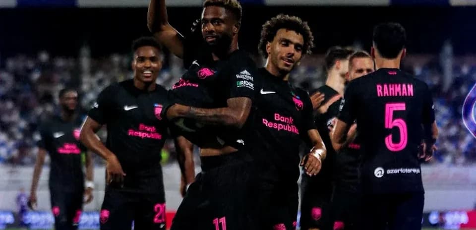 Players celebrating a goal during UEFA match