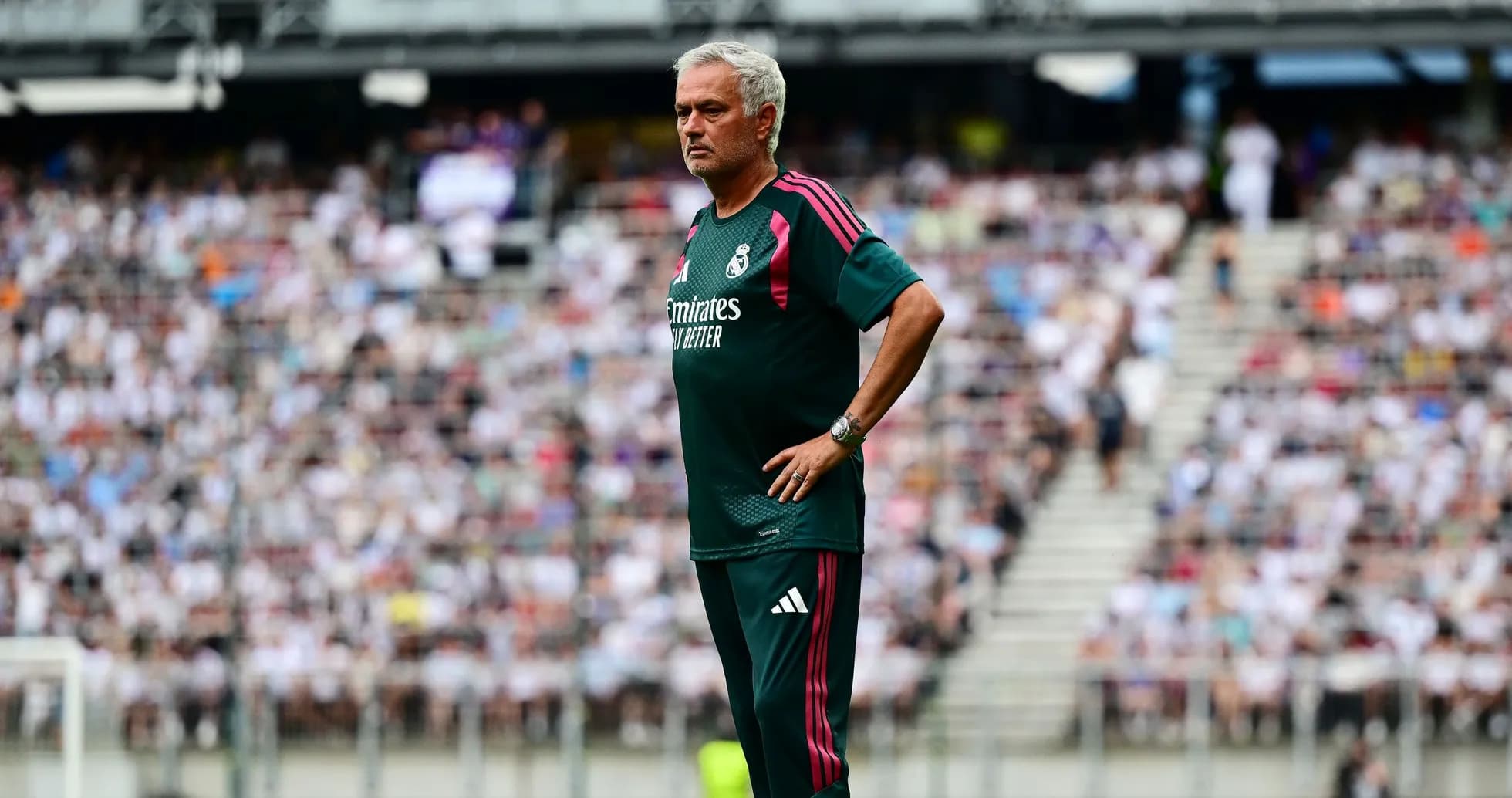Manager observing match from the sidelines