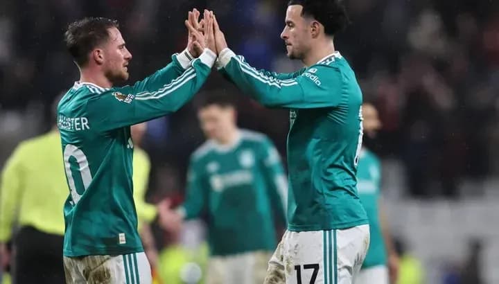 Two players celebrating with a high five