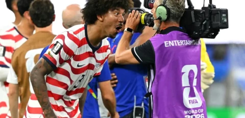 Player celebrating near camera after match victory