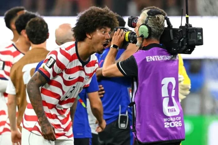 Player celebrating near camera after match victory