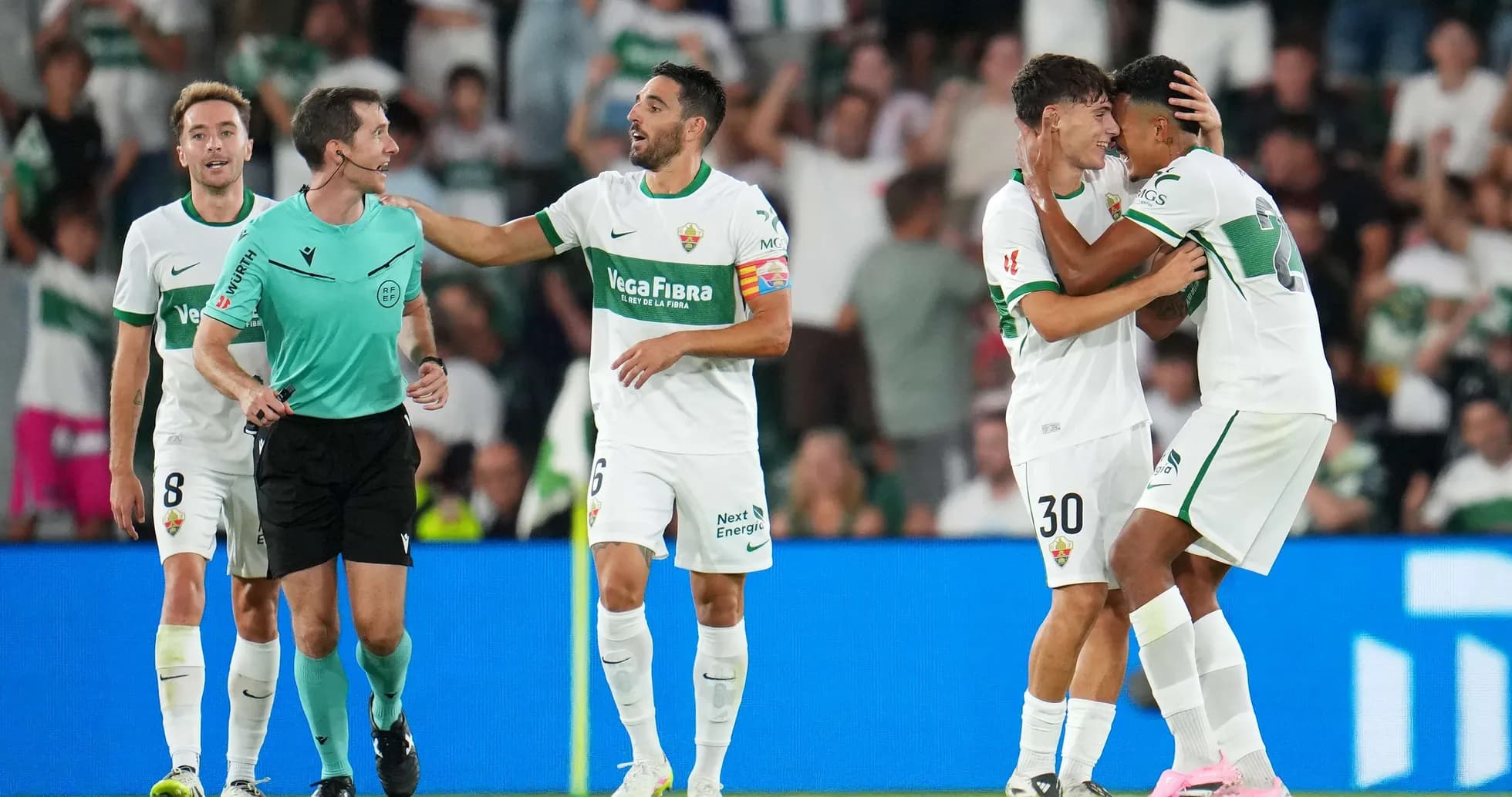 Elche players celebrating a goal during match