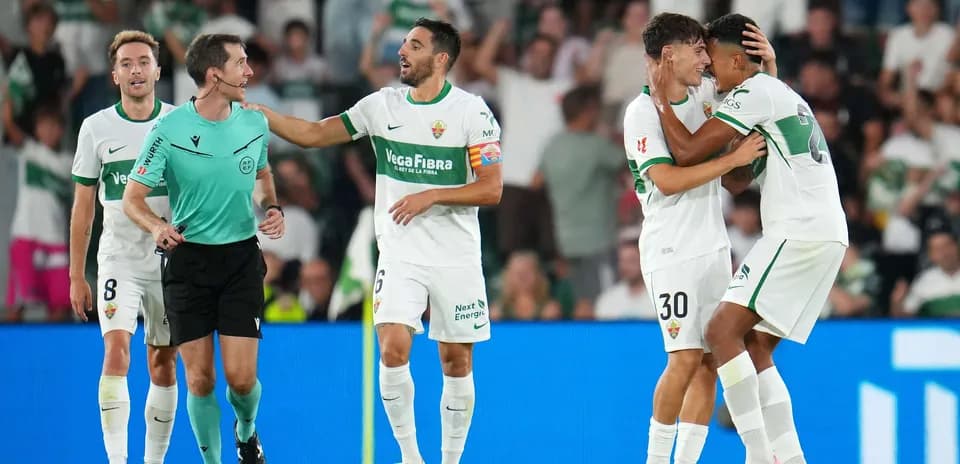 Elche players celebrating a goal during match