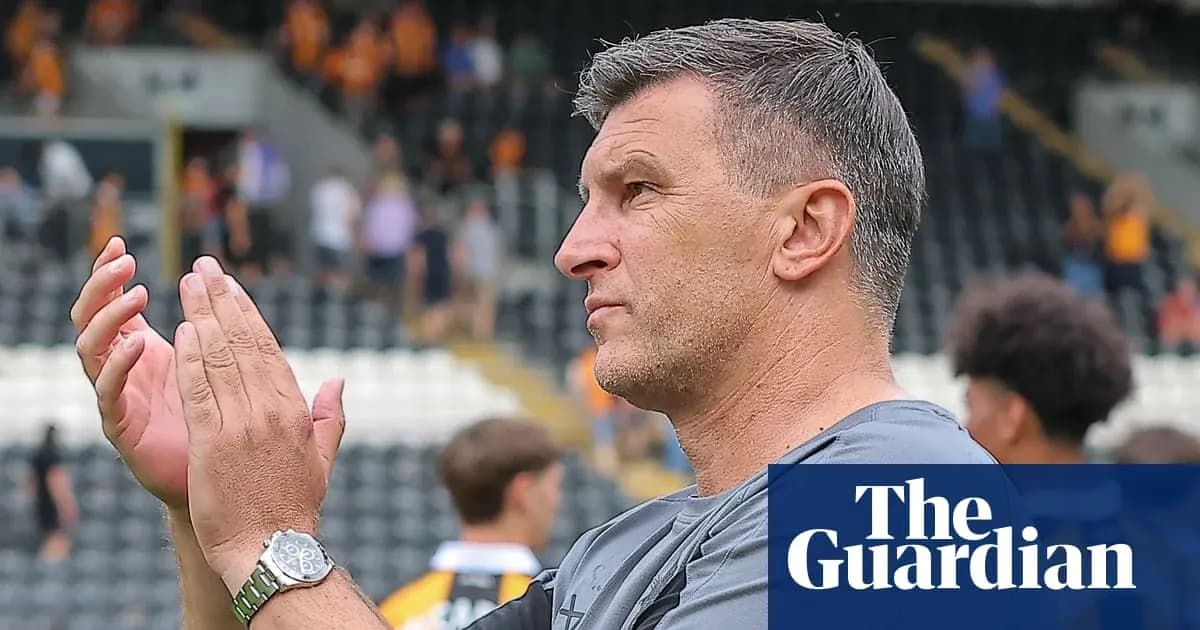 Coach applauding supporters after the match