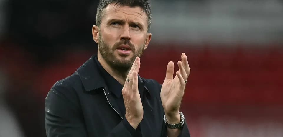 Coach applauding during a match on the sideline