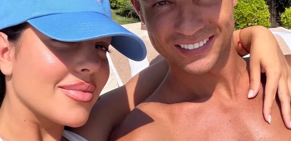 Couple posing together in a sunny setting