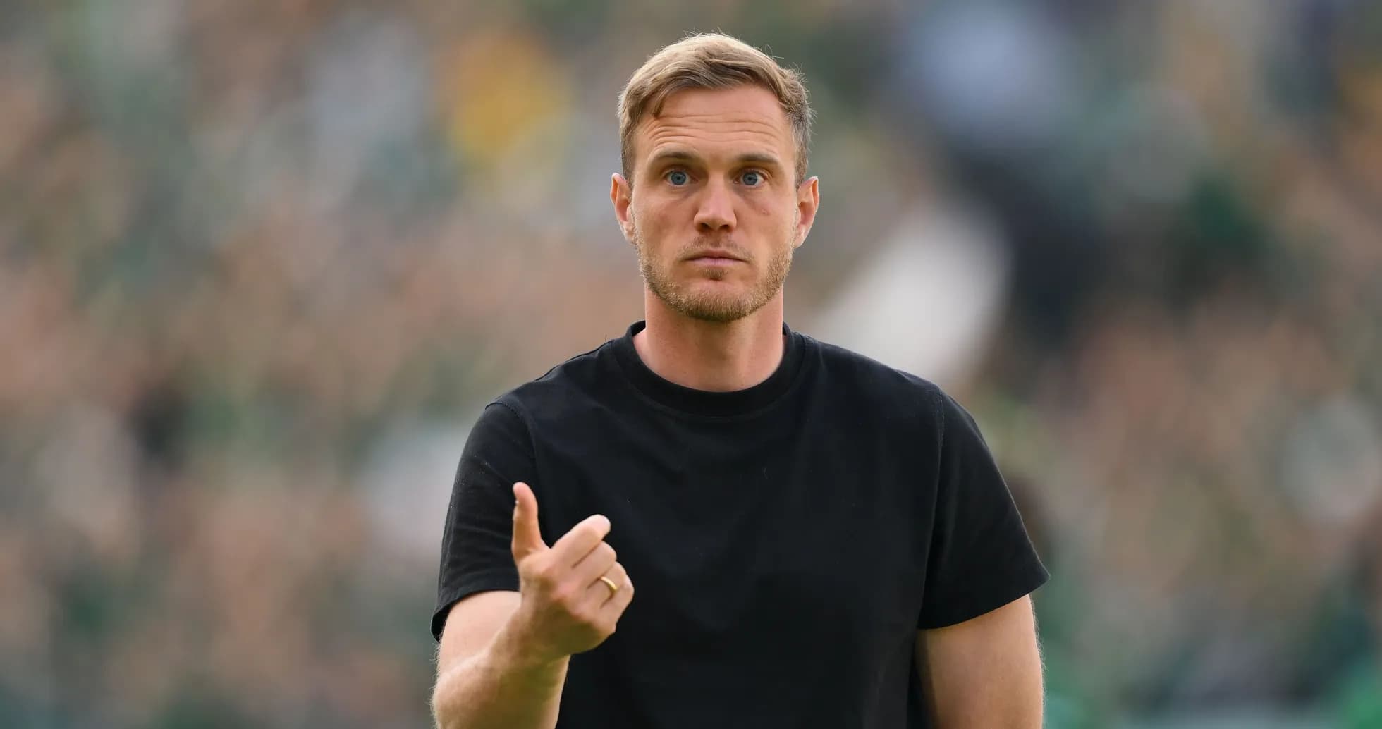 Coach gesturing during a match on the sidelines