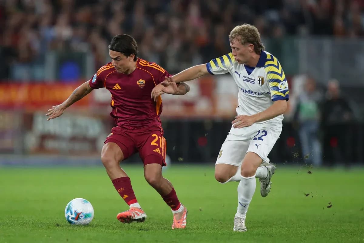 AS Roma player challenged by Parma opponent