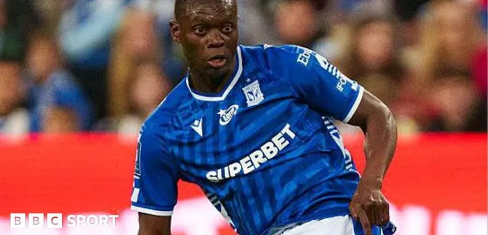 Player in blue kit performing during a match