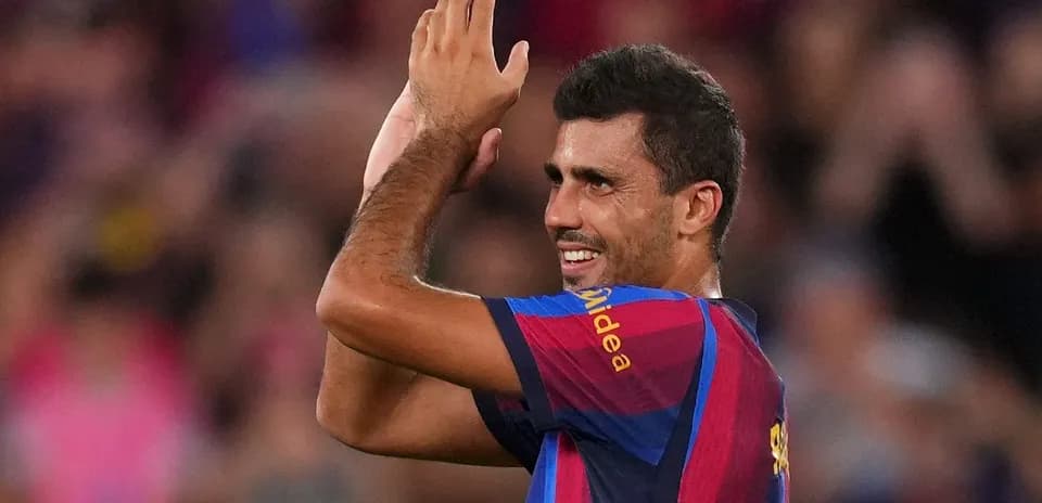 Player applauding fans during match at stadium