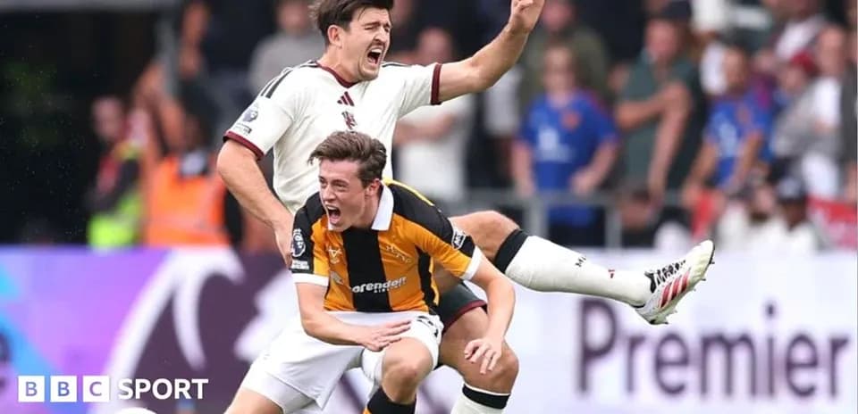 Two players competing for the ball during match