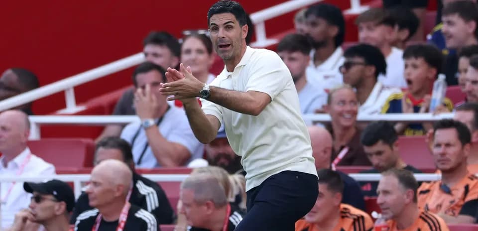Manager gesturing on the sidelines during match