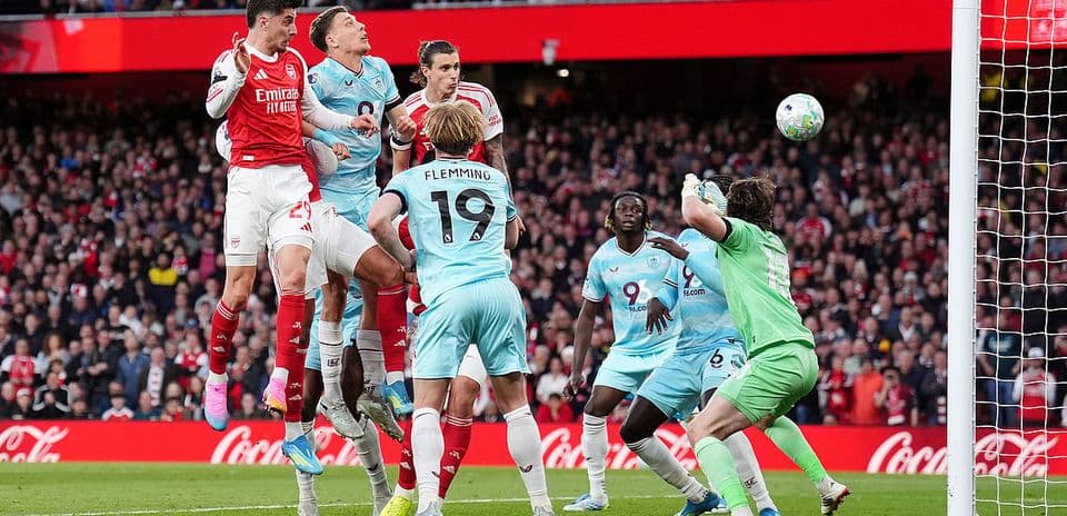 Arsenal player jumping to score against Burnley