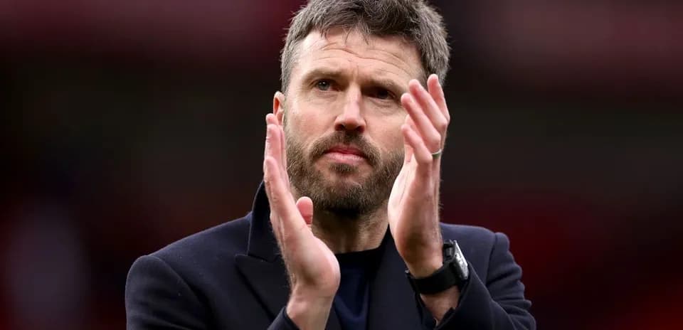 Coach applauding during match at stadium