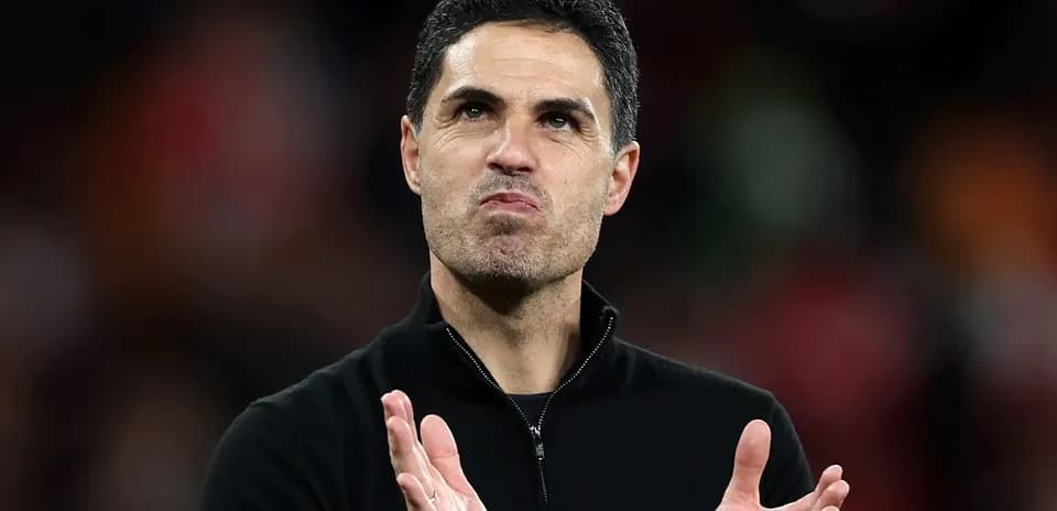 Manager clapping during a match at the stadium