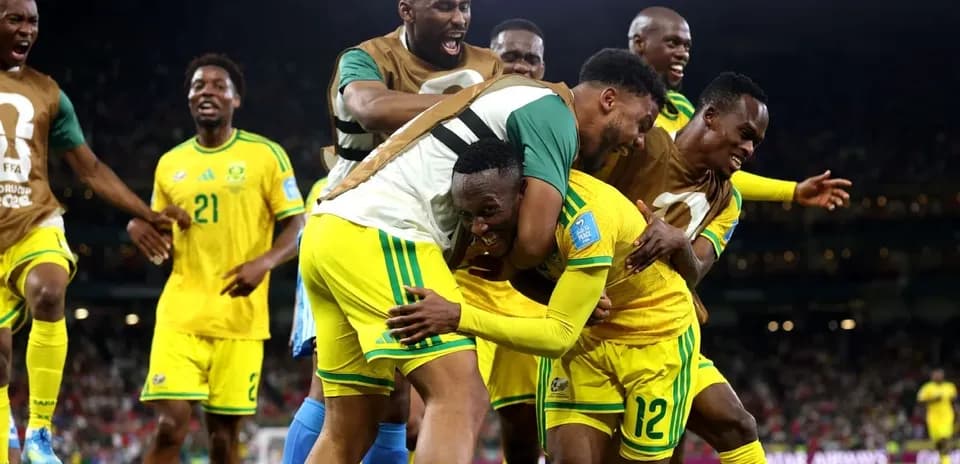 Players celebrating a goal during a match