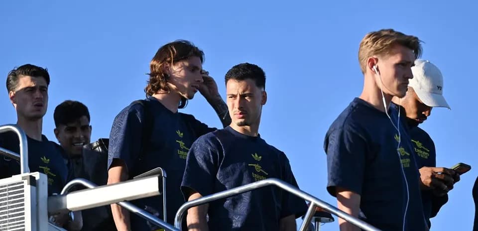 Players descending steps, wearing team training attire