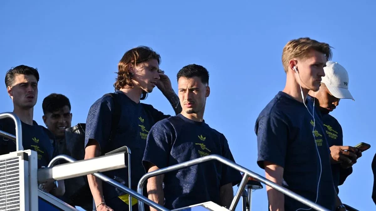 Players descending steps, wearing team training attire