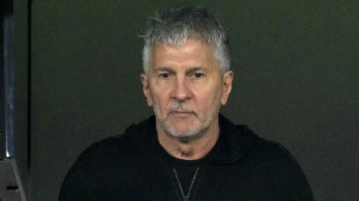 Man with gray hair wearing a black jacket