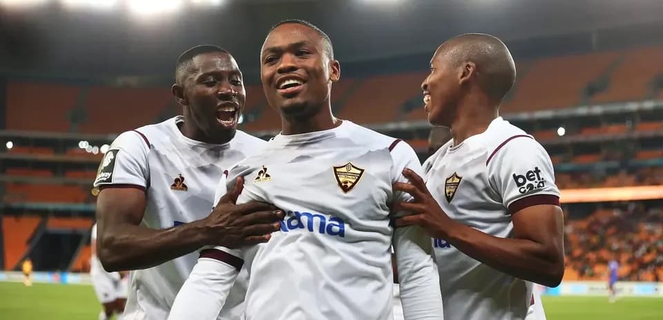 Players celebrating a goal during a football match