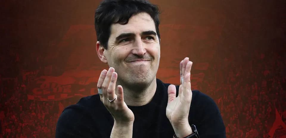 Coach applauding after match in stadium