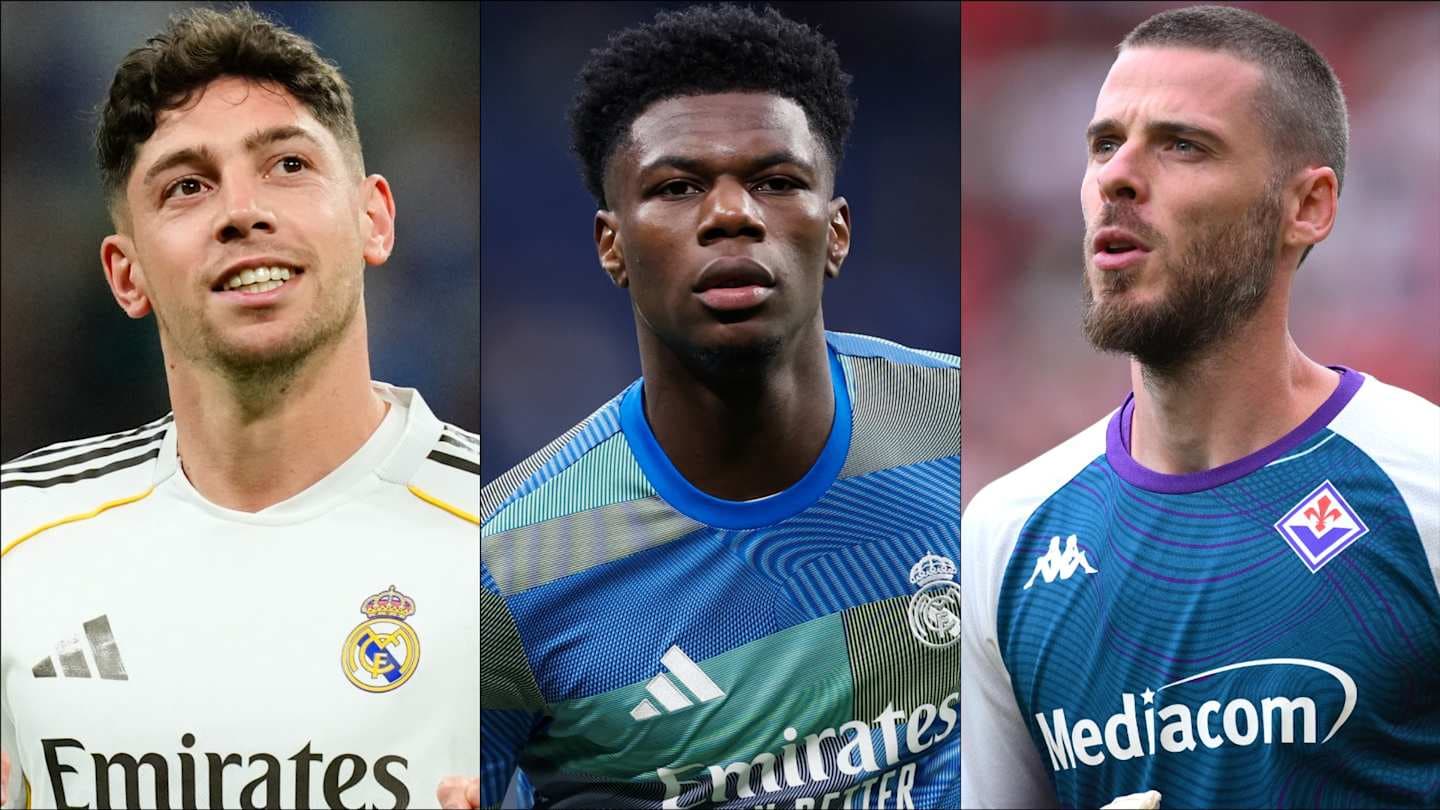 Three football players in team jerseys looking ahead