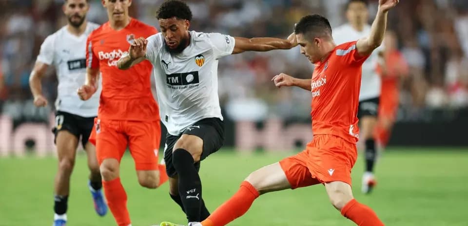 Players contesting for the ball during La Liga match