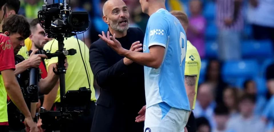 Manager discussing with player during match stoppage