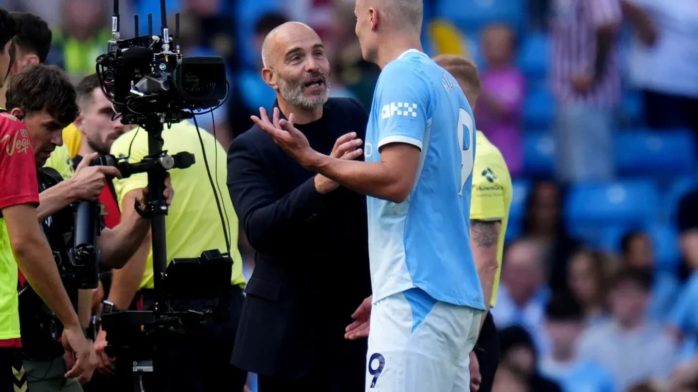 Manager discussing with player during match stoppage