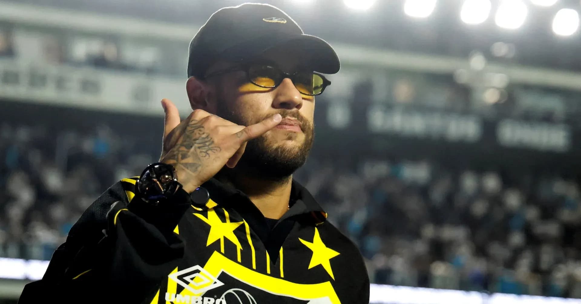 Man making a gesture in a sports venue
