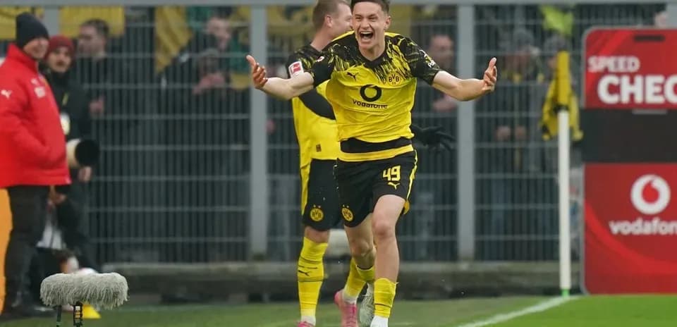 Player celebrating after scoring a goal for Dortmund