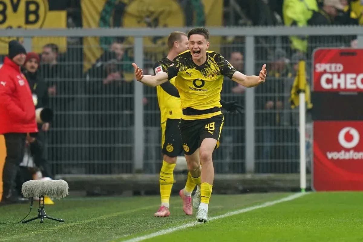 Player celebrating after scoring a goal for Dortmund