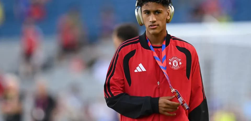 Player wearing headphones before match at stadium