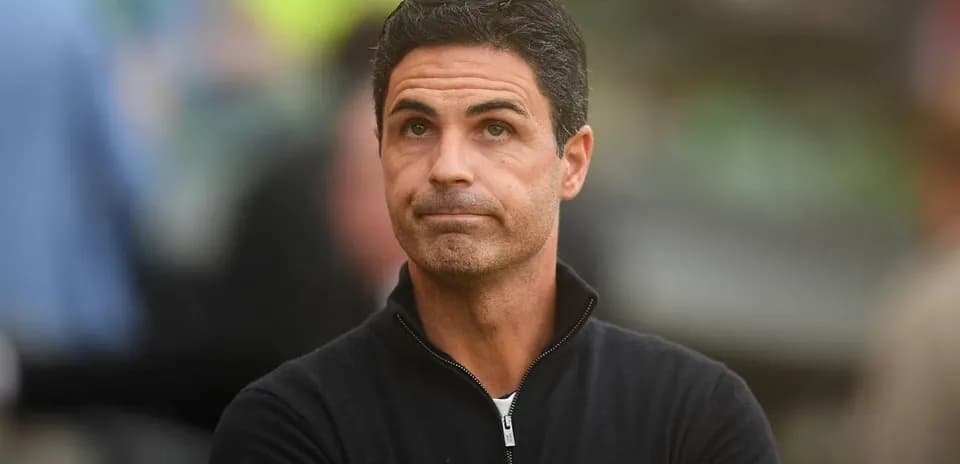 Coach observing match from the sidelines
