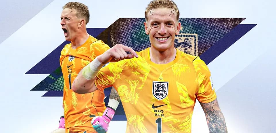 Goalkeeper celebrating in yellow kit with tattoos