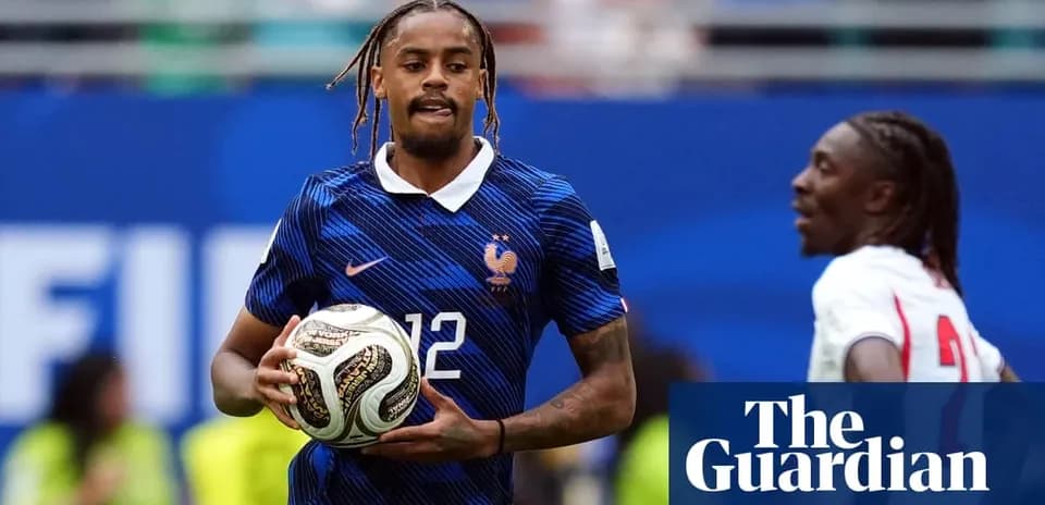 Player in France kit holding a soccer ball