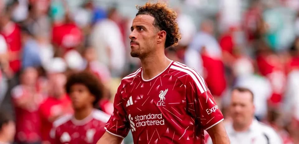 Liverpool player walking through crowd after match