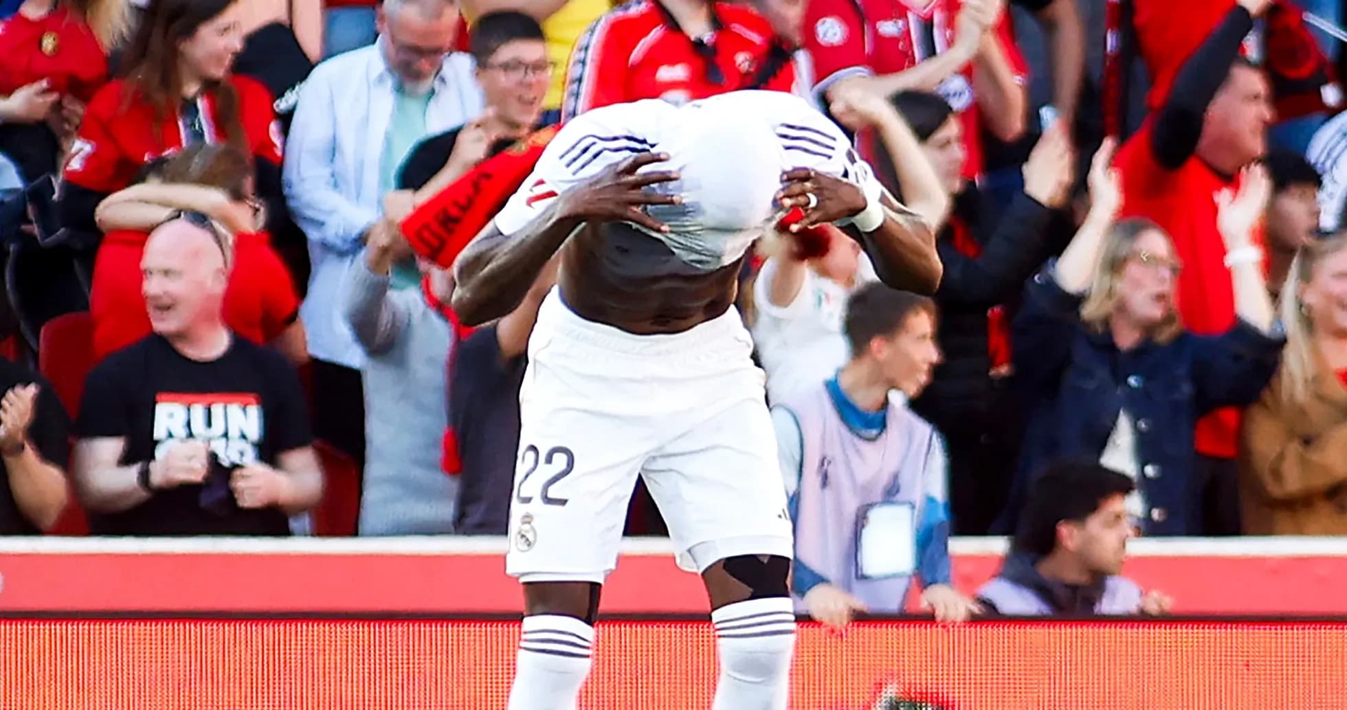 Player celebrating in front of cheering fans