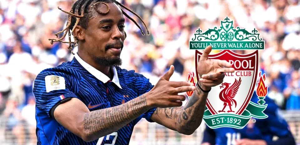 Player celebrating with Liverpool logo in background