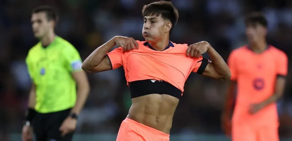 Player removing shirt during match on field