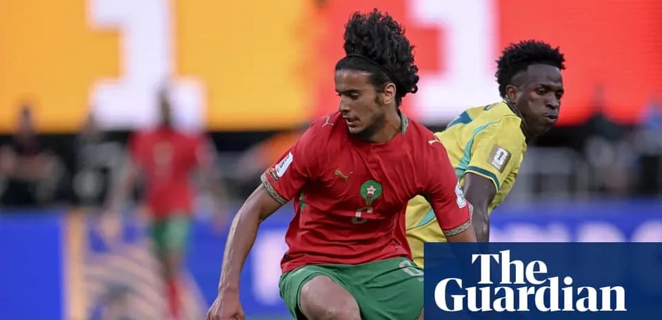 Moroccan player evading opponent during football match