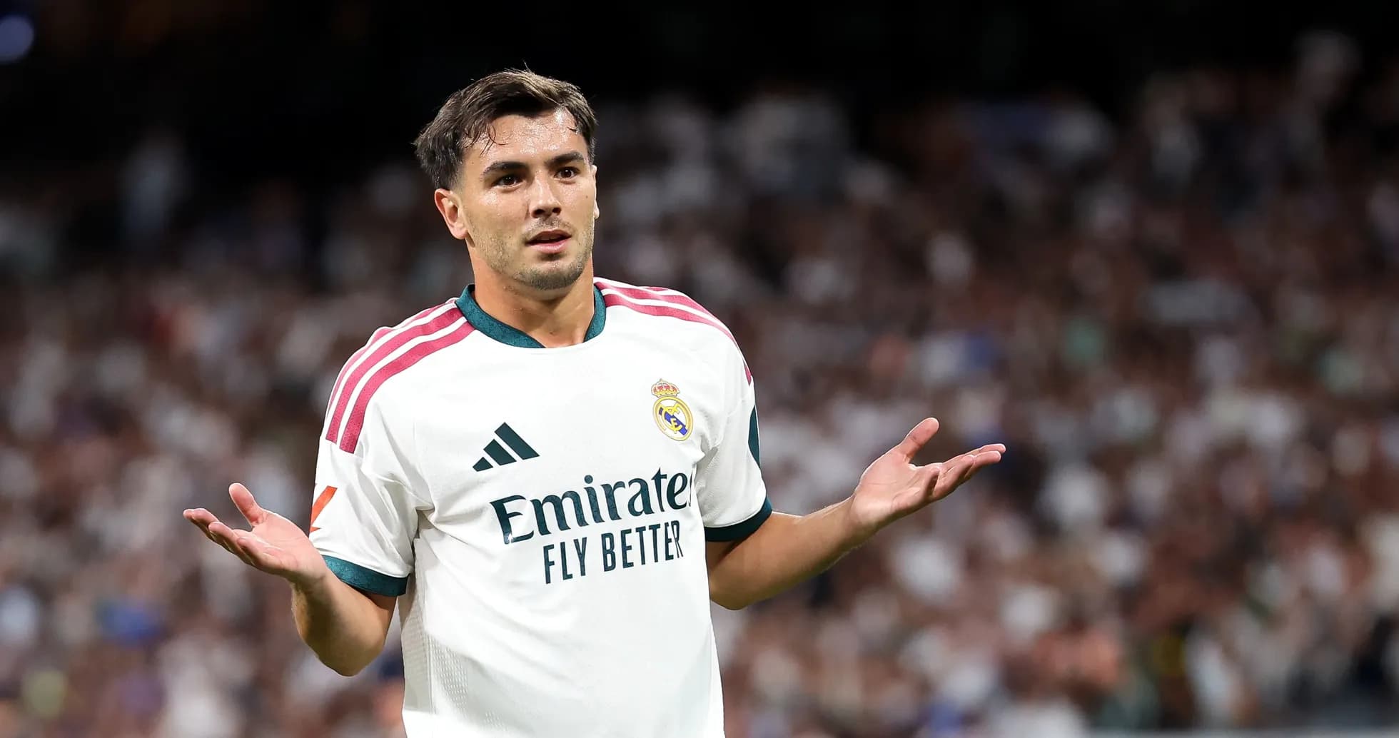 Player gesturing during match in Real Madrid uniform