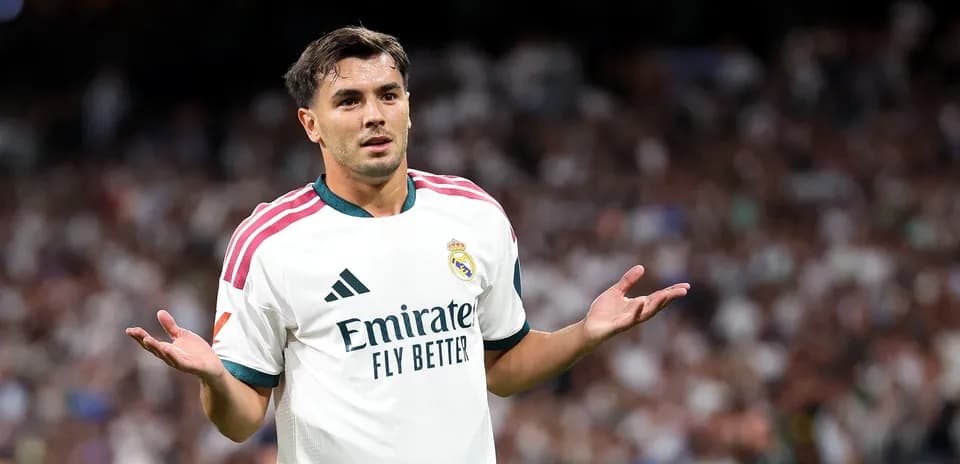 Player gesturing during match in Real Madrid uniform